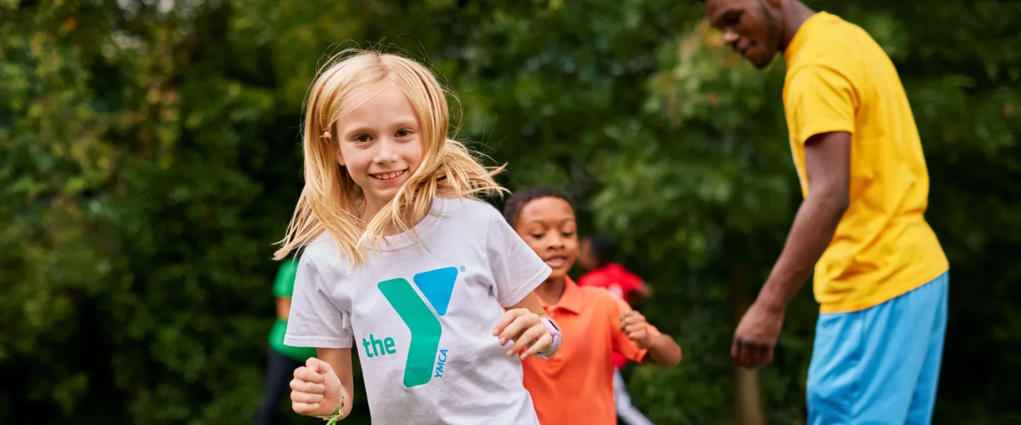 Smiling girl playing outside