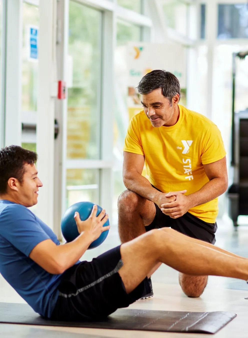 Man working out with trainer