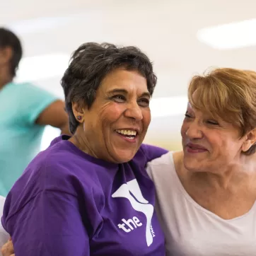 Two adult women smiling