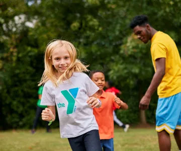 Smiling girl playing outside