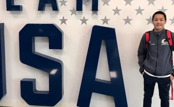 Steven in front of Team USA sign