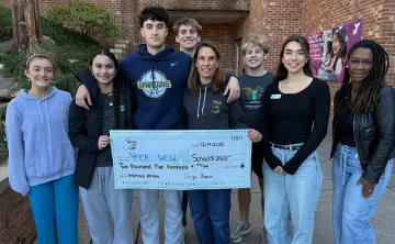 Stroll into Light presenting check to WGW